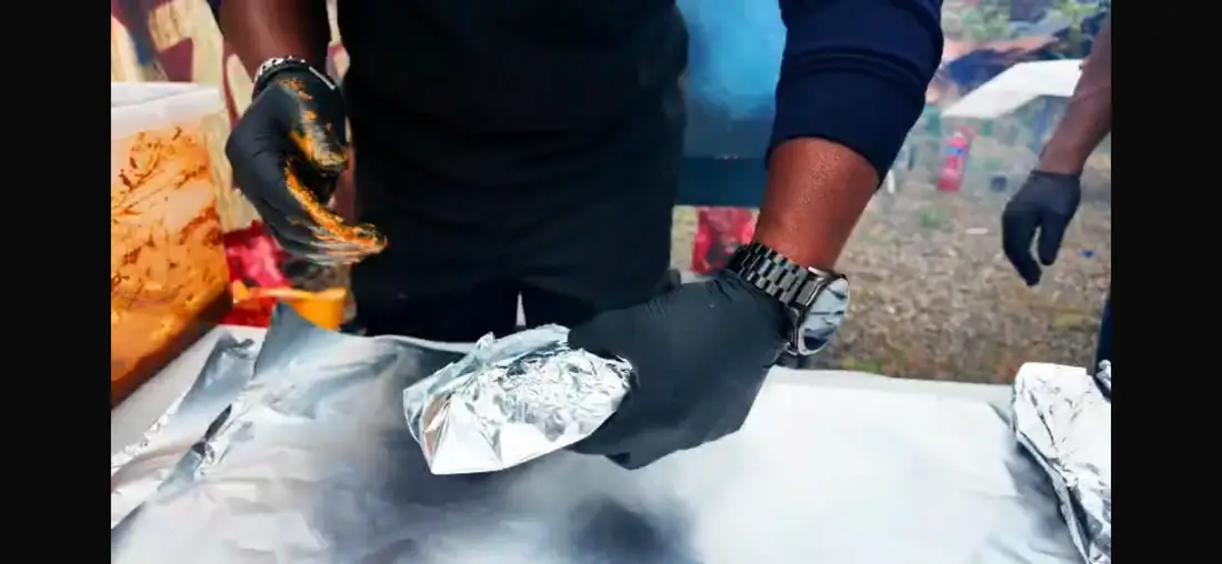 Catering food being wrapped in foil