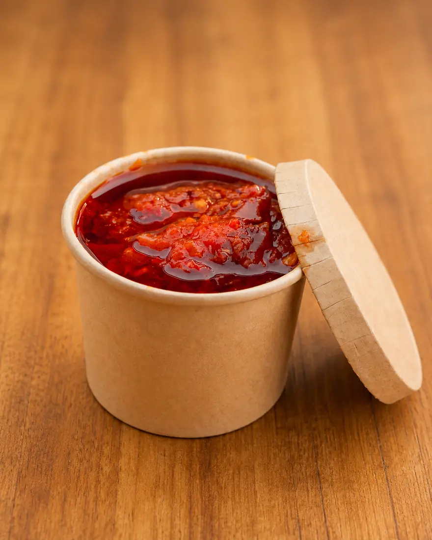 Signature spicy dip in a sauce pot