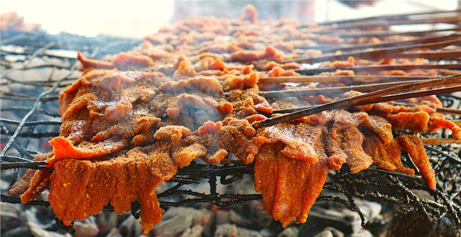 Beef suya on the grill