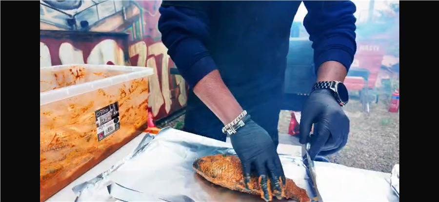 Seasoned fish being prepared for grilling
